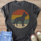 Dark grey t-shirt with German Shepherd silhouette on a vintage sunset circle graphic.