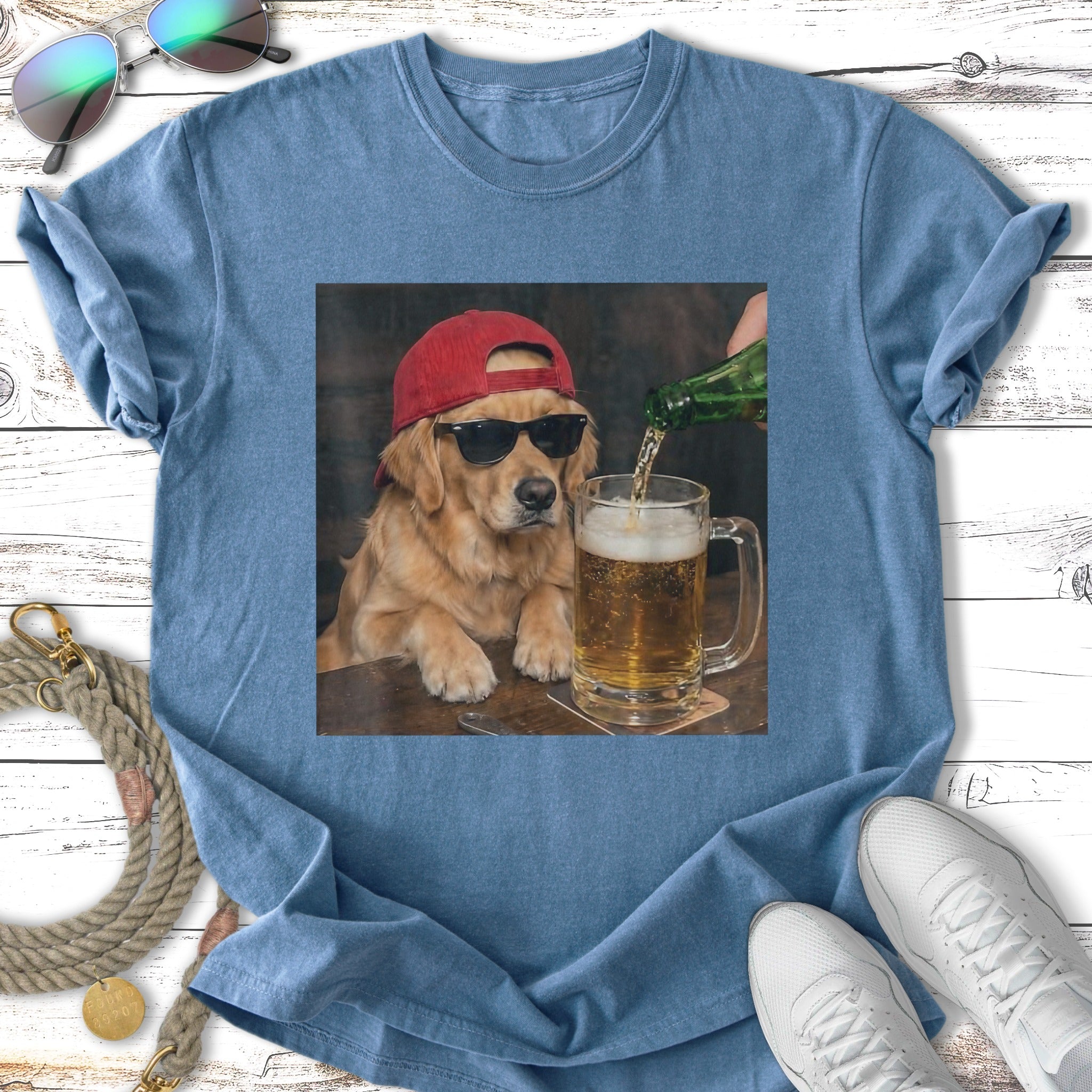 Golden retriever wearing a red baseball cap and sunglasses, pouring beer into a mug.