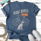 T-shirt with "Ride Bikes Pet Dogs" text and vintage bicycle illustration.