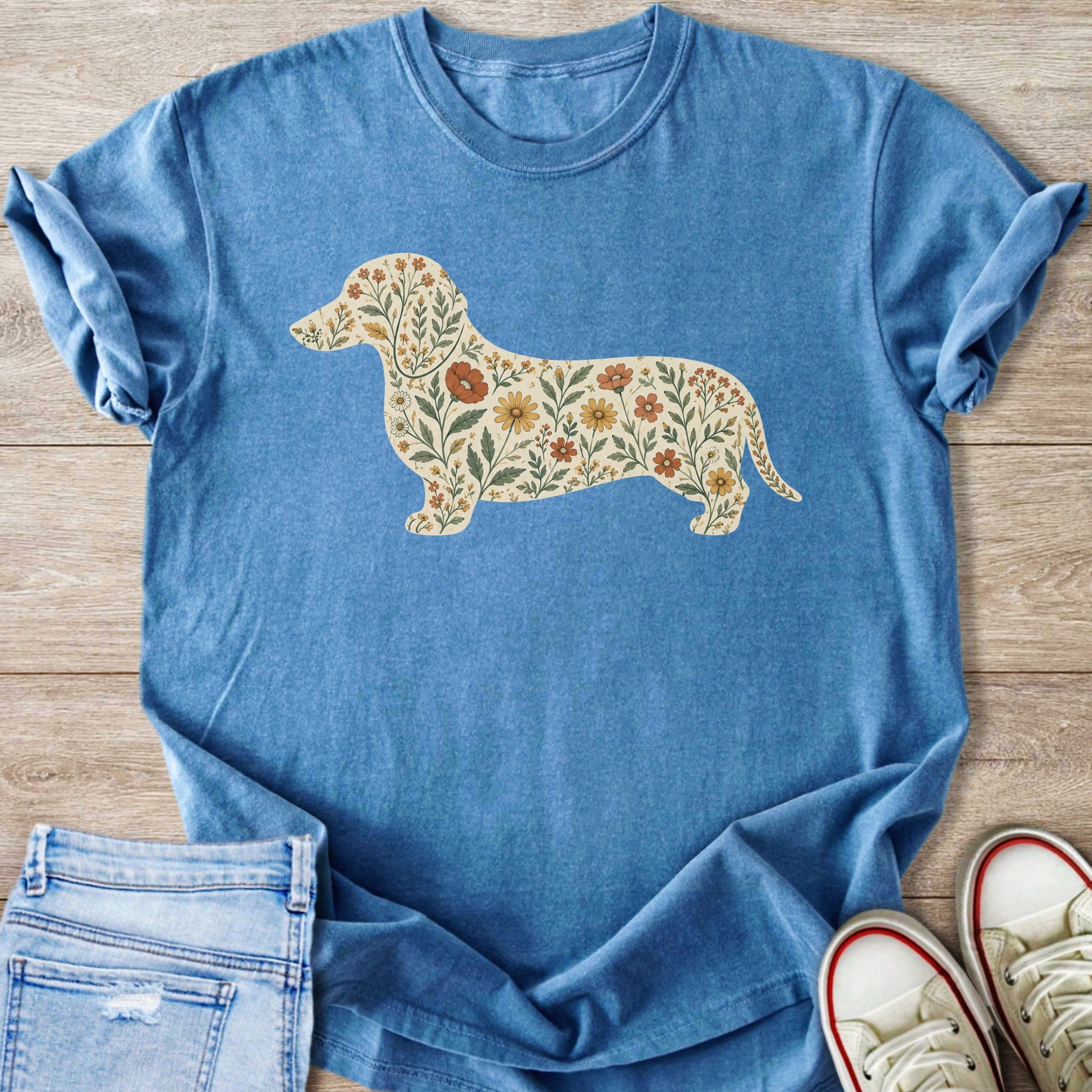 Blue t-shirt with a floral dachshund silhouette graphic.