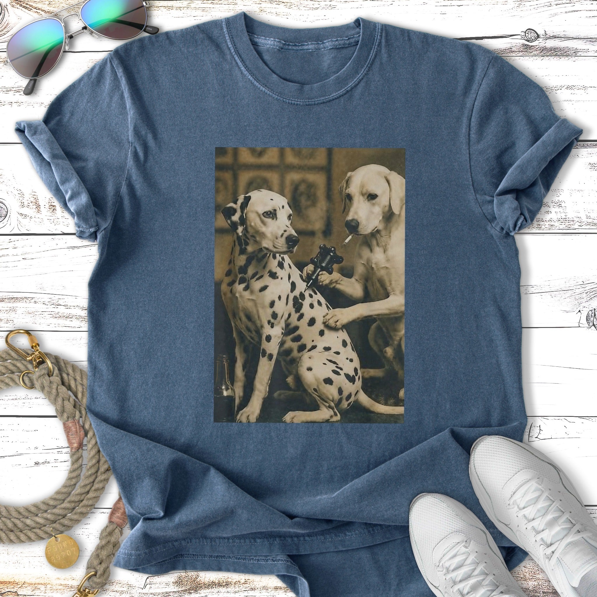 Dalmatian getting tattooed by a Labrador in a vintage style.