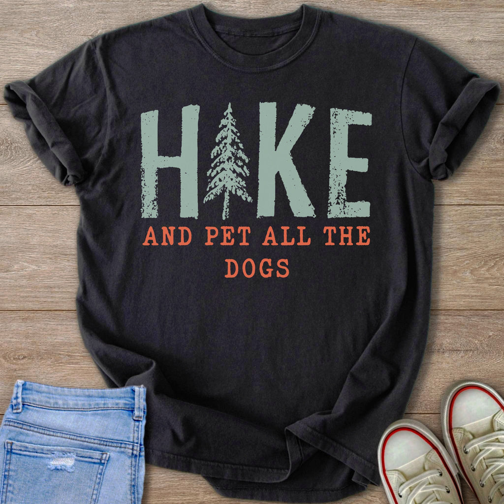 Dark t-shirt with "HIKE" and a pine tree, "AND PET ALL THE DOGS."