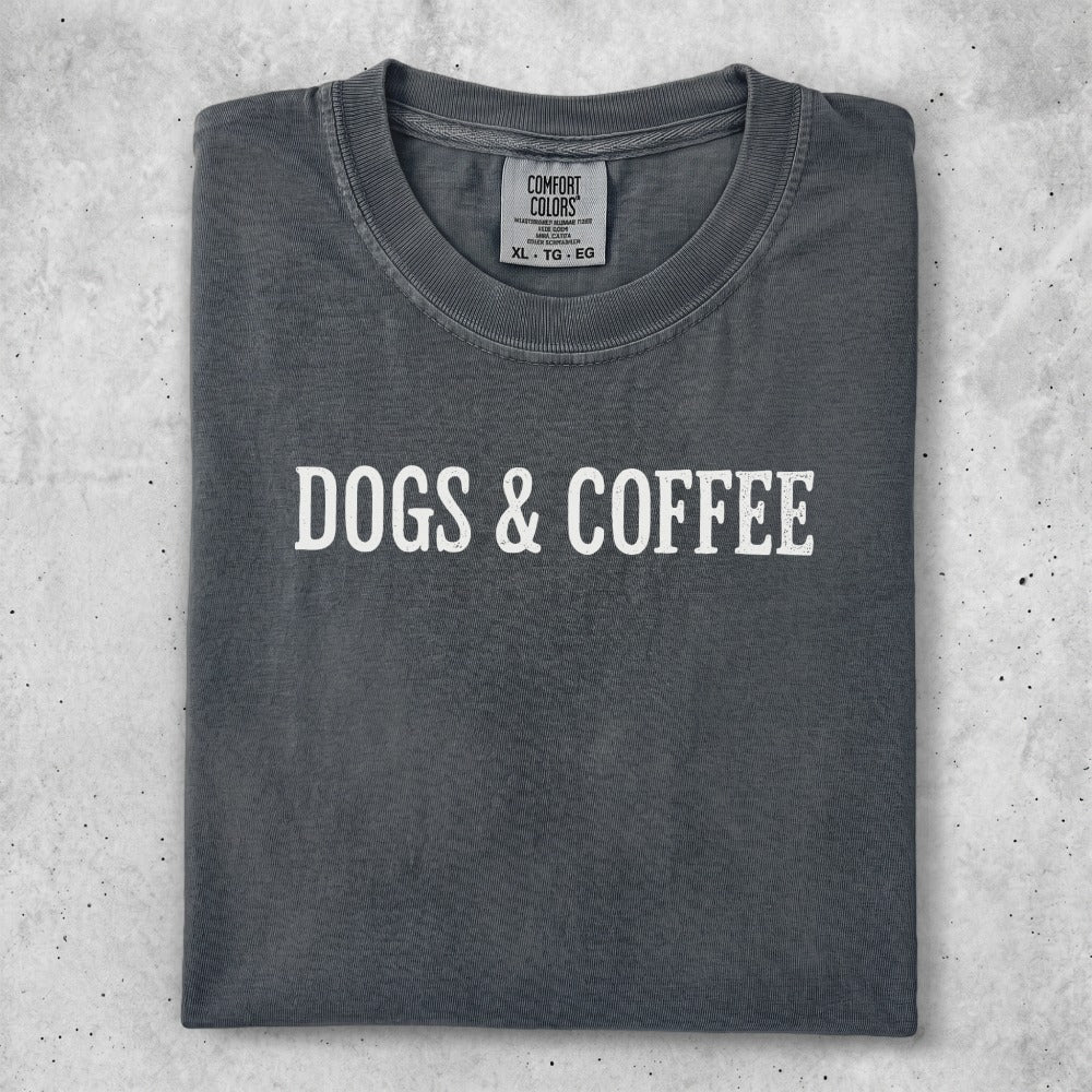Dark grey t-shirt with "DOGS & COFFEE" in white text.