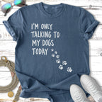 Blue t-shirt with white text "I'M ONLY TALKING TO MY DOGS TODAY" and paw prints.