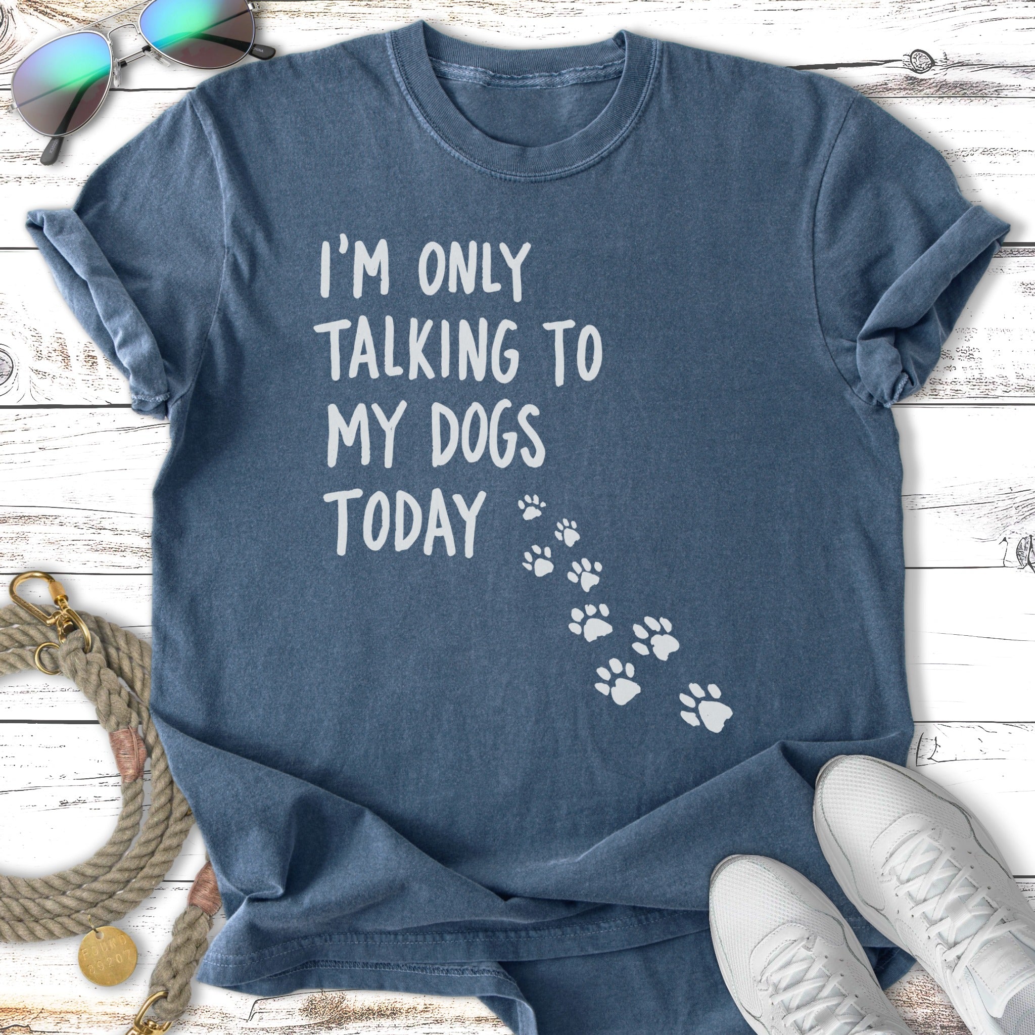 Blue t-shirt with white text "I'M ONLY TALKING TO MY DOGS TODAY" and paw prints.