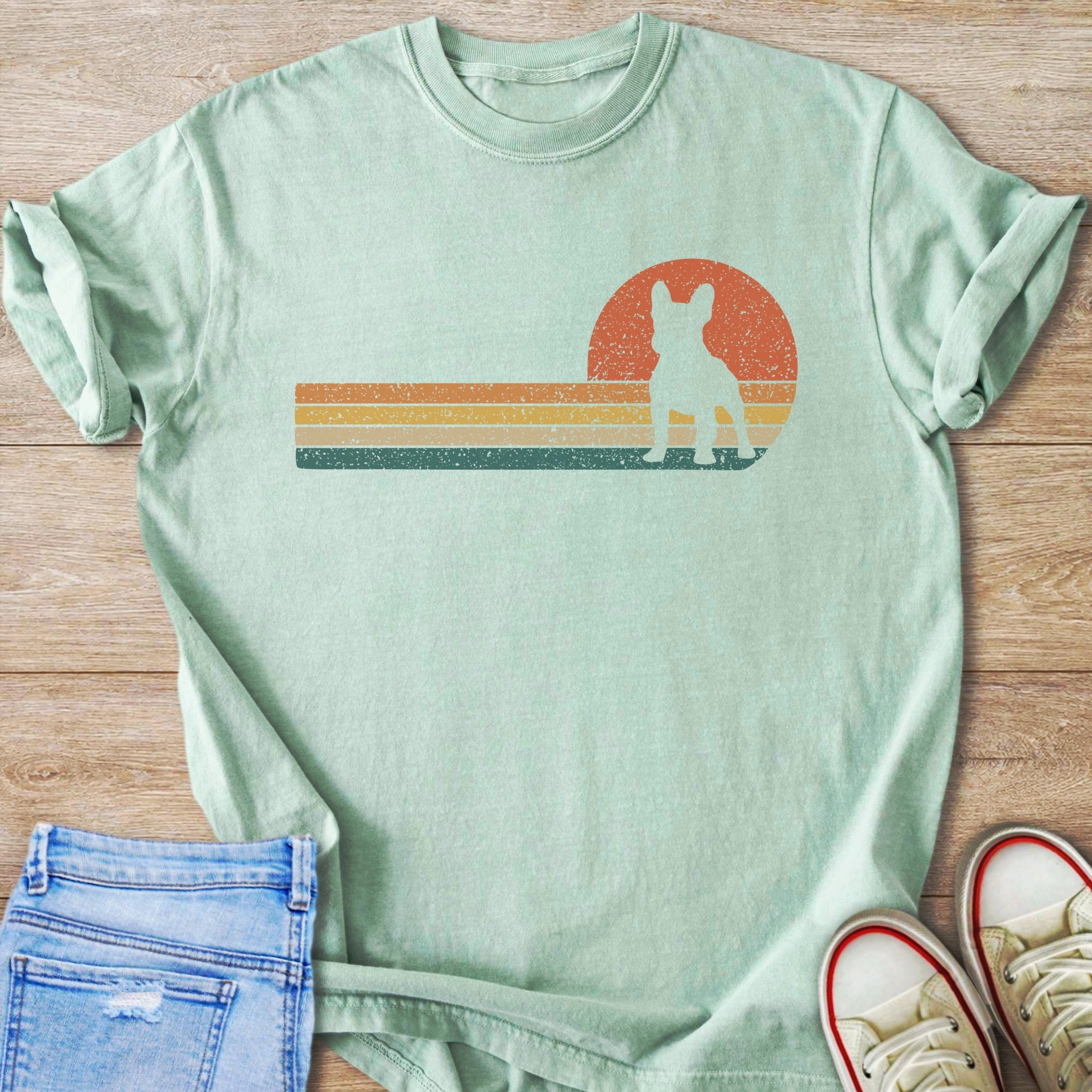Light green t-shirt with distressed retro French Bulldog sunset graphic.