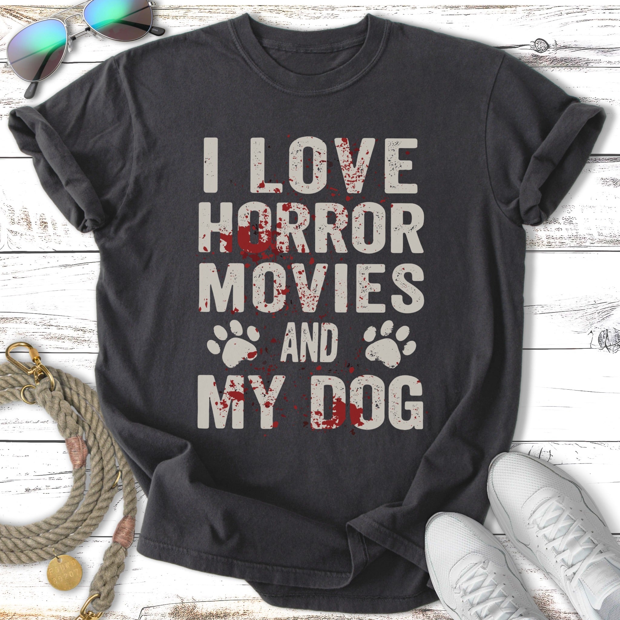 Black t-shirt with "I love horror movies and my dog" and paw prints.