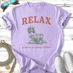 Lilac t-shirt with "RELAX NOTHING IS UNDER CONTROL" and a cowboy graphic.