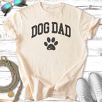 Cream t-shirt with black "Dog Dad" text and a paw print.