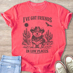 Corgi in cowboy hat and bandana with cacti, sun, and bird. "I've Got Friends In Low Places."