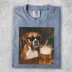 Boxer dog wearing sunglasses pours beer into a mug.
