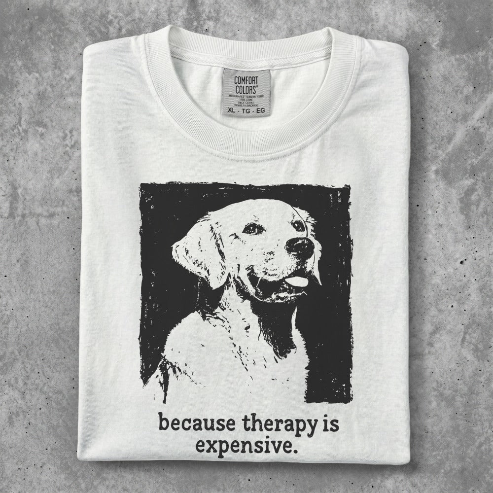 White t-shirt with a black ink sketch of a golden retriever and text.