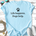 Light blue t-shirt with "Life happens. Dogs help." text and paw print.
