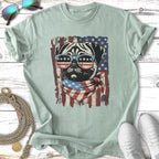 Pug wearing sunglasses and bandana in front of distressed American flag.