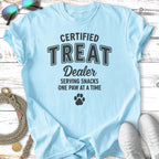 Light blue t-shirt with "CERTIFIED TREAT Dealer" and paw print.