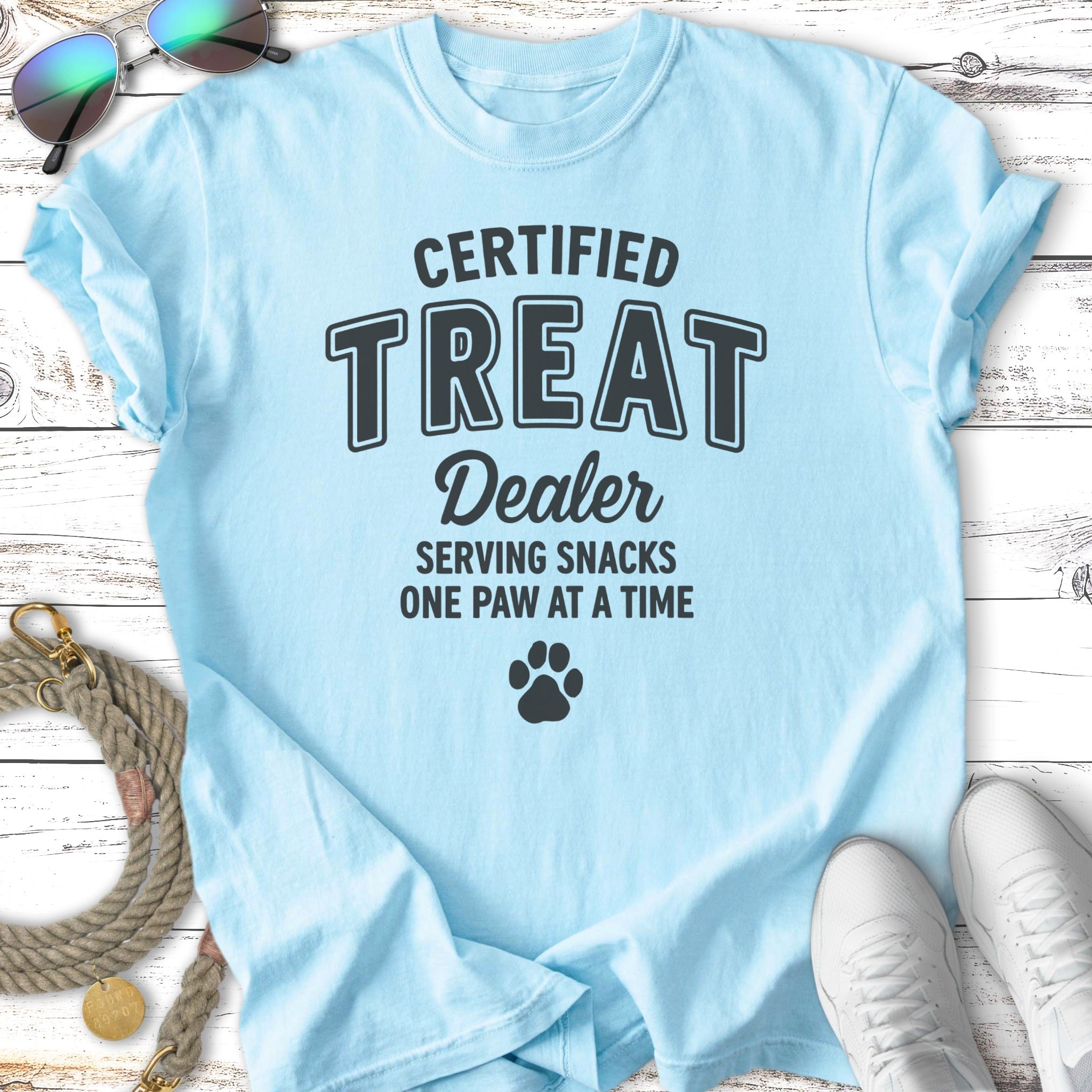 Light blue t-shirt with "CERTIFIED TREAT Dealer" and paw print.