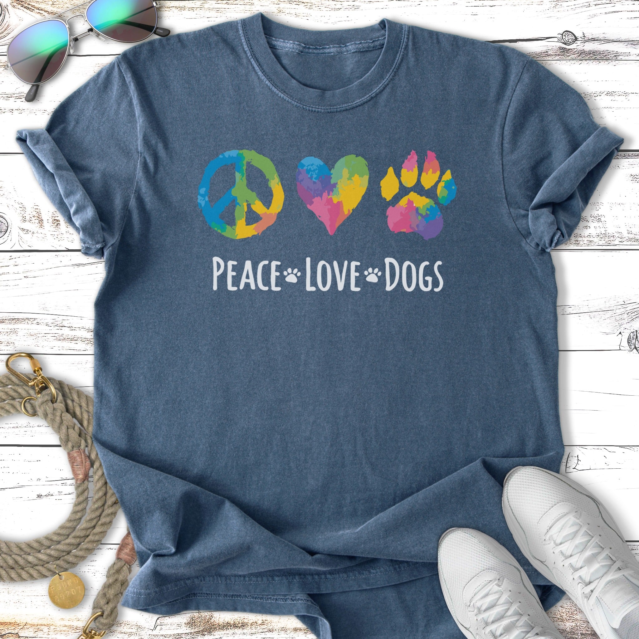 T-shirt with peace, heart, and paw print symbols above "Peace Love Dogs" text.
