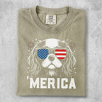 Dog wearing sunglasses with American flag print, "MERICA" text.