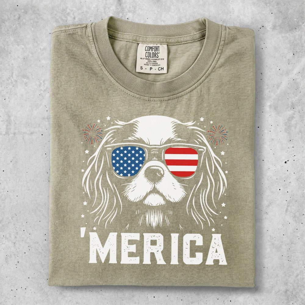 Dog wearing sunglasses with American flag print, "MERICA" text.