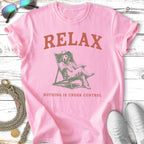 Pink t-shirt with "RELAX NOTHING IS UNDER CONTROL" and dog in lounge chair.