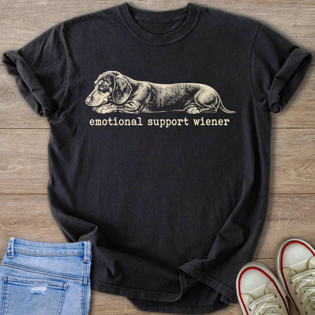 Dark t-shirt with a sketch of a dachshund and the text "emotional support wiener".