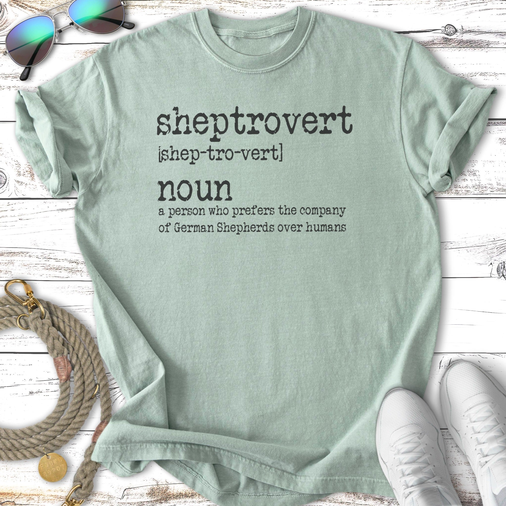 Light green t-shirt with "sheptrovert" and definition about German Shepherds.