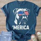 White boxer dog wearing American flag sunglasses and the text 'MERICA.