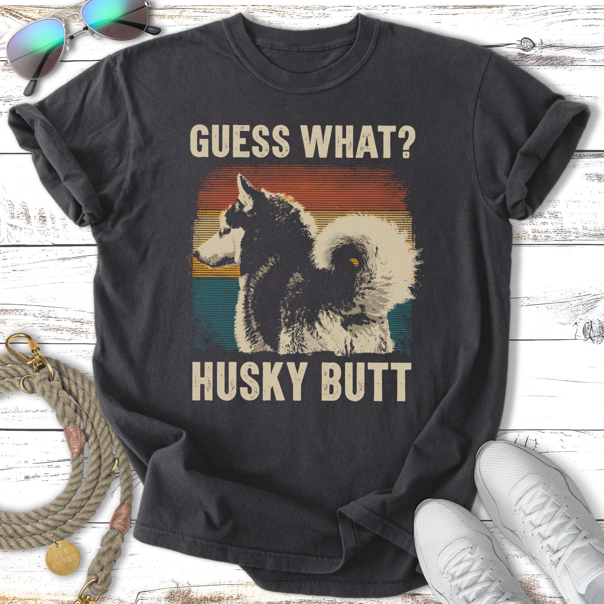Black t-shirt with "Guess What? Husky Butt" text and a husky dog graphic.
