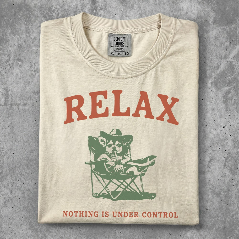 Cream t-shirt with "RELAX" above a dog in a cowboy hat drinking from a straw.