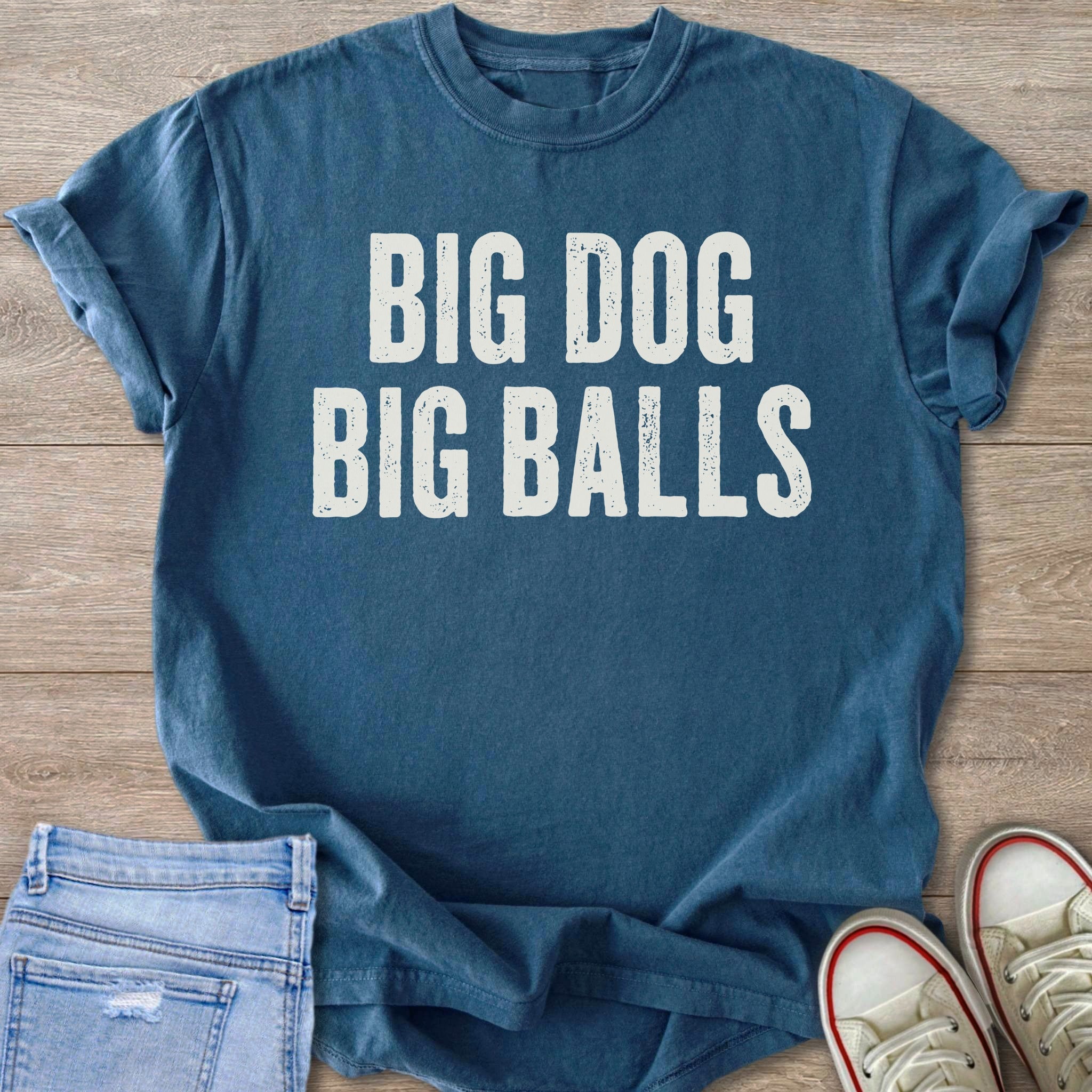 Blue t-shirt with white text "BIG DOG BIG BALLS" on display.