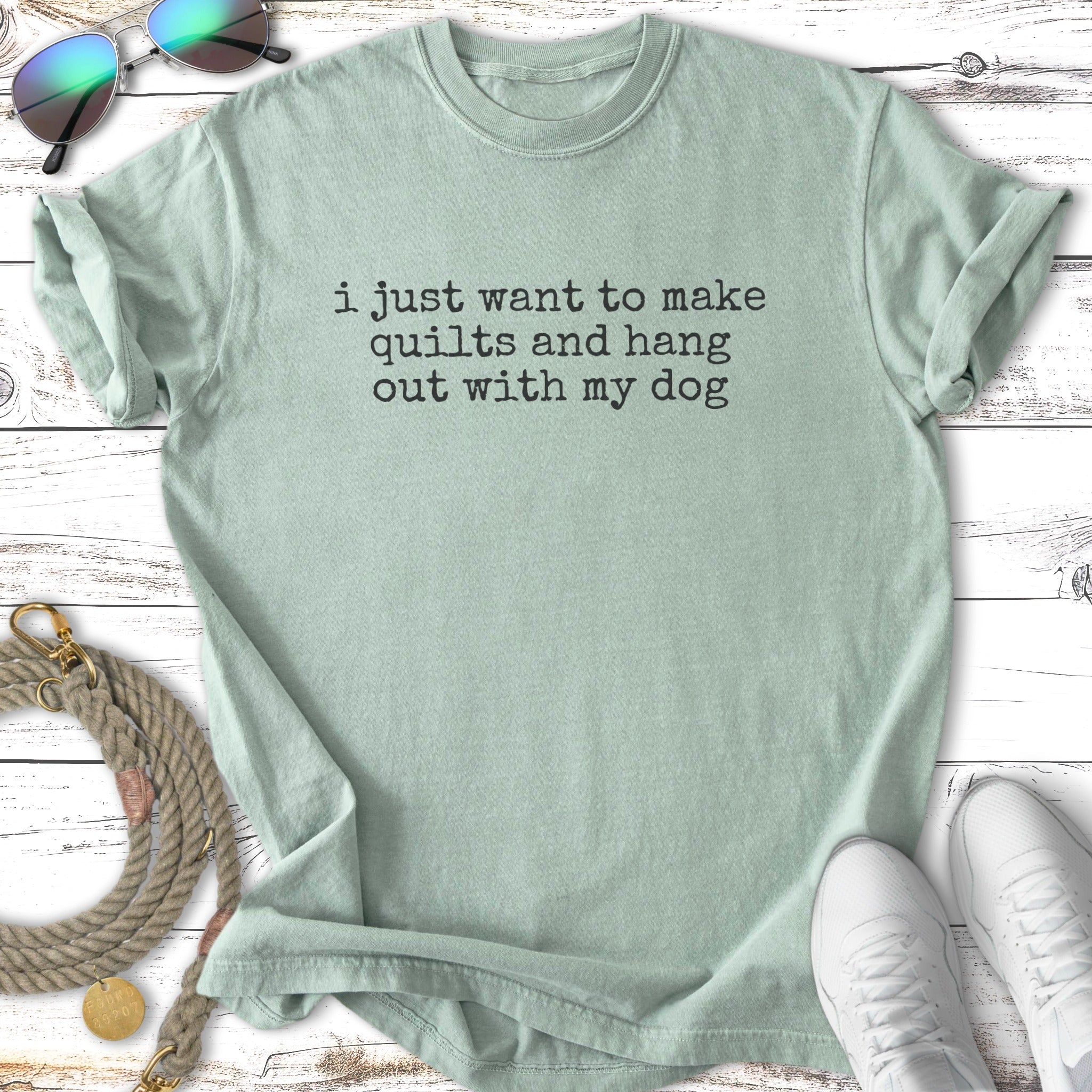 Light green t-shirt with text "i just want to make quilts and hang out with my dog".