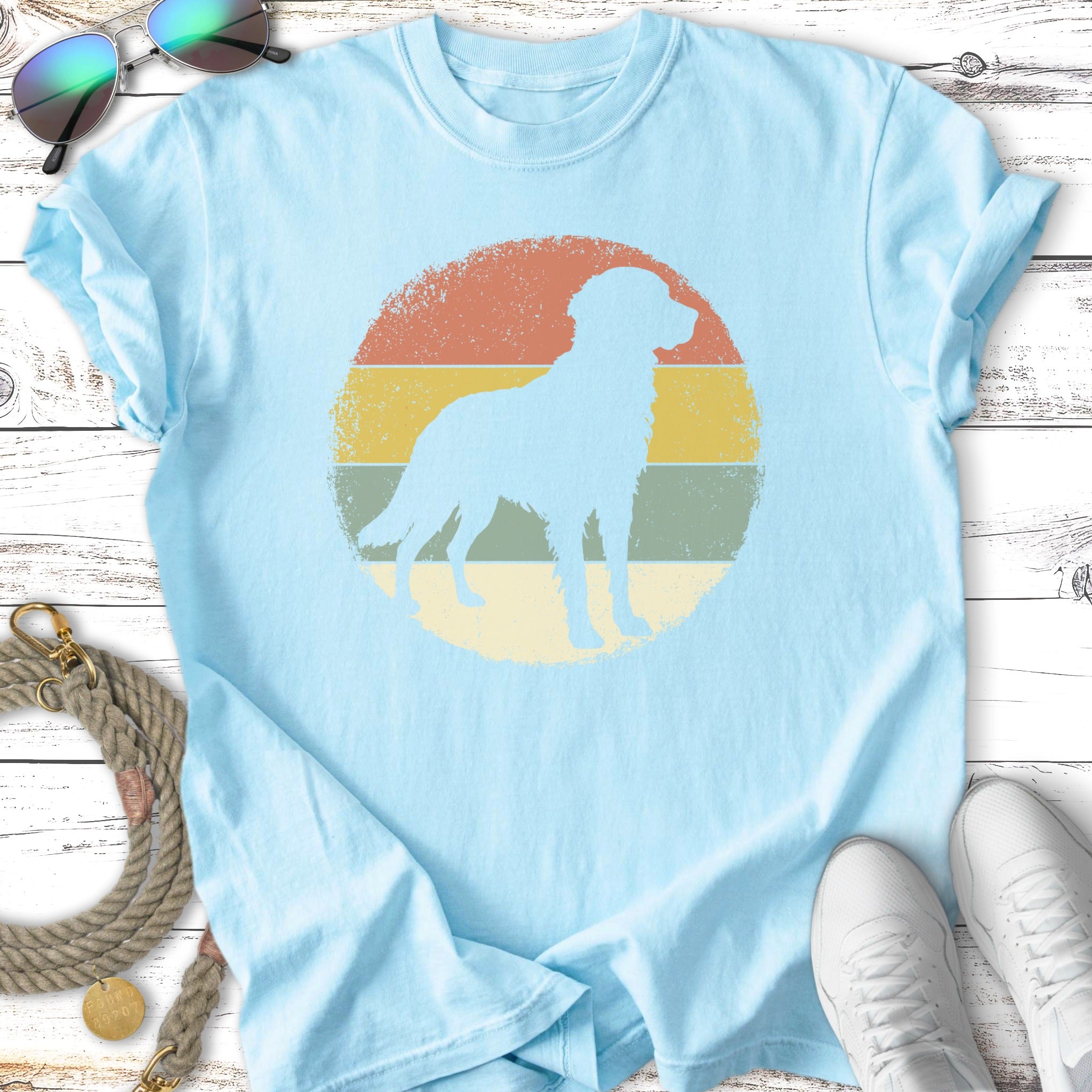 Light blue t-shirt with a vintage-style dog silhouette on a distressed circle.