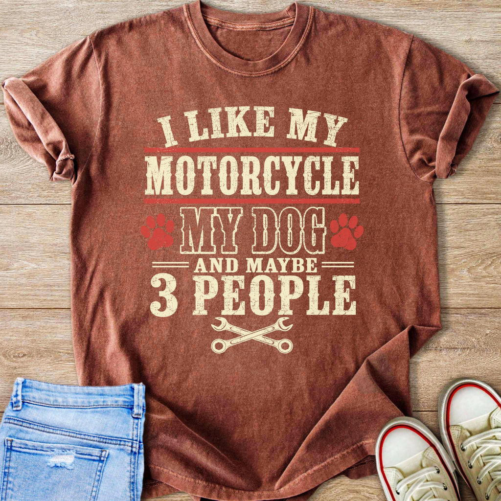 T-shirt with "I like my motorcycle, my dog and maybe 3 people" text and wrench graphic.