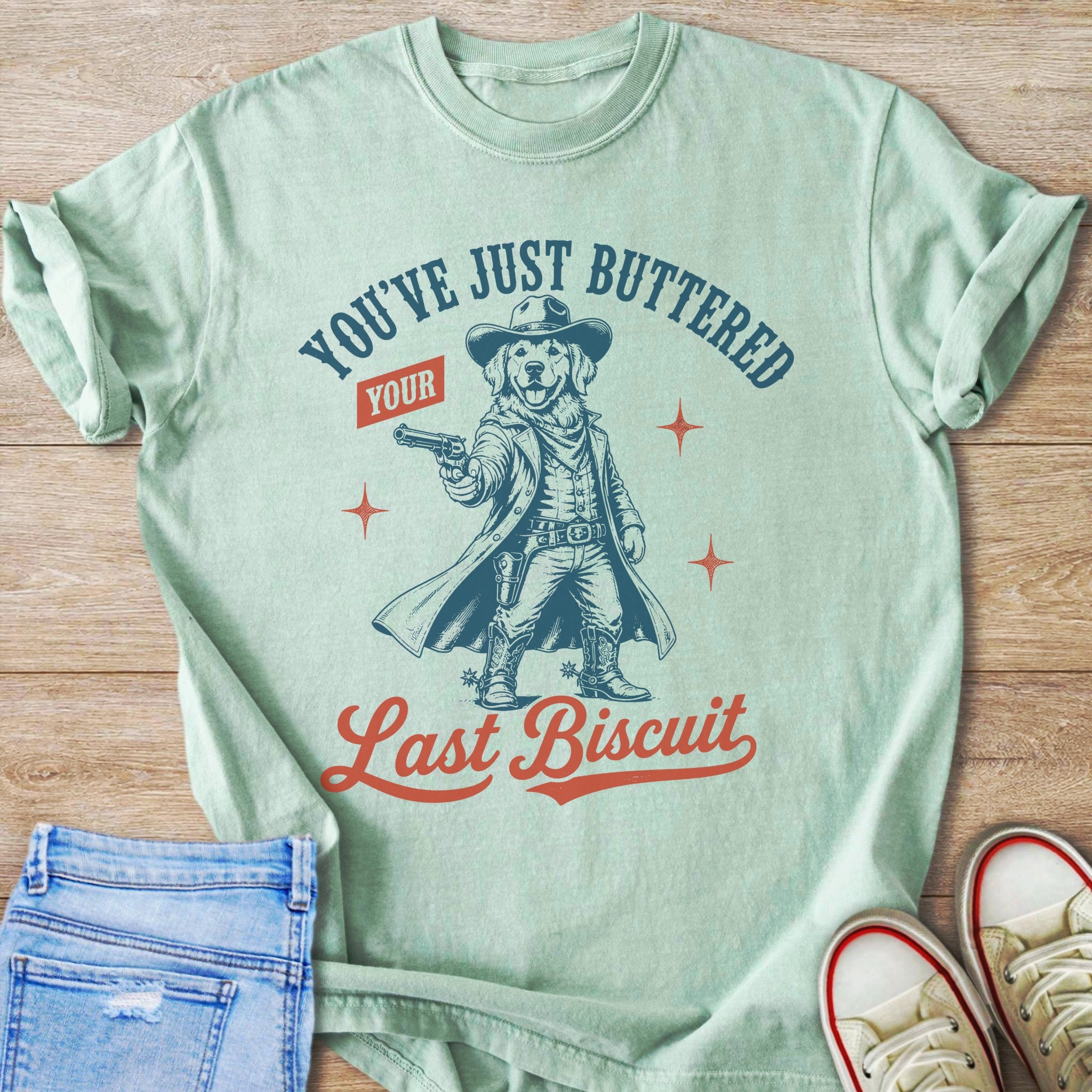 Golden retriever in cowboy attire with text "You've Just Buttered Your Last Biscuit."