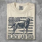 Cream t-shirt with distressed US flag and black Labrador graphic, "BLACK LAB DAD" text.
