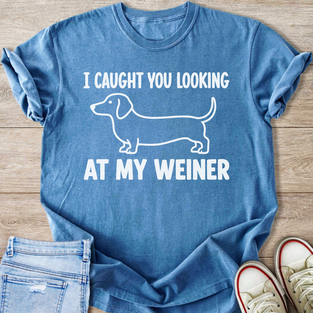 Blue t-shirt with white dachshund silhouette and "I CAUGHT YOU LOOKING AT MY WEINER" text.