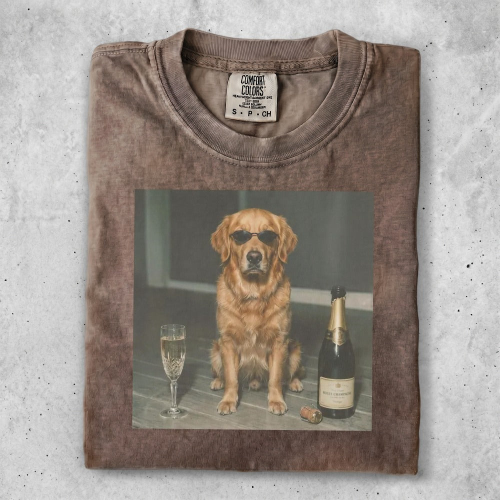 Golden retriever in sunglasses with champagne and glass.