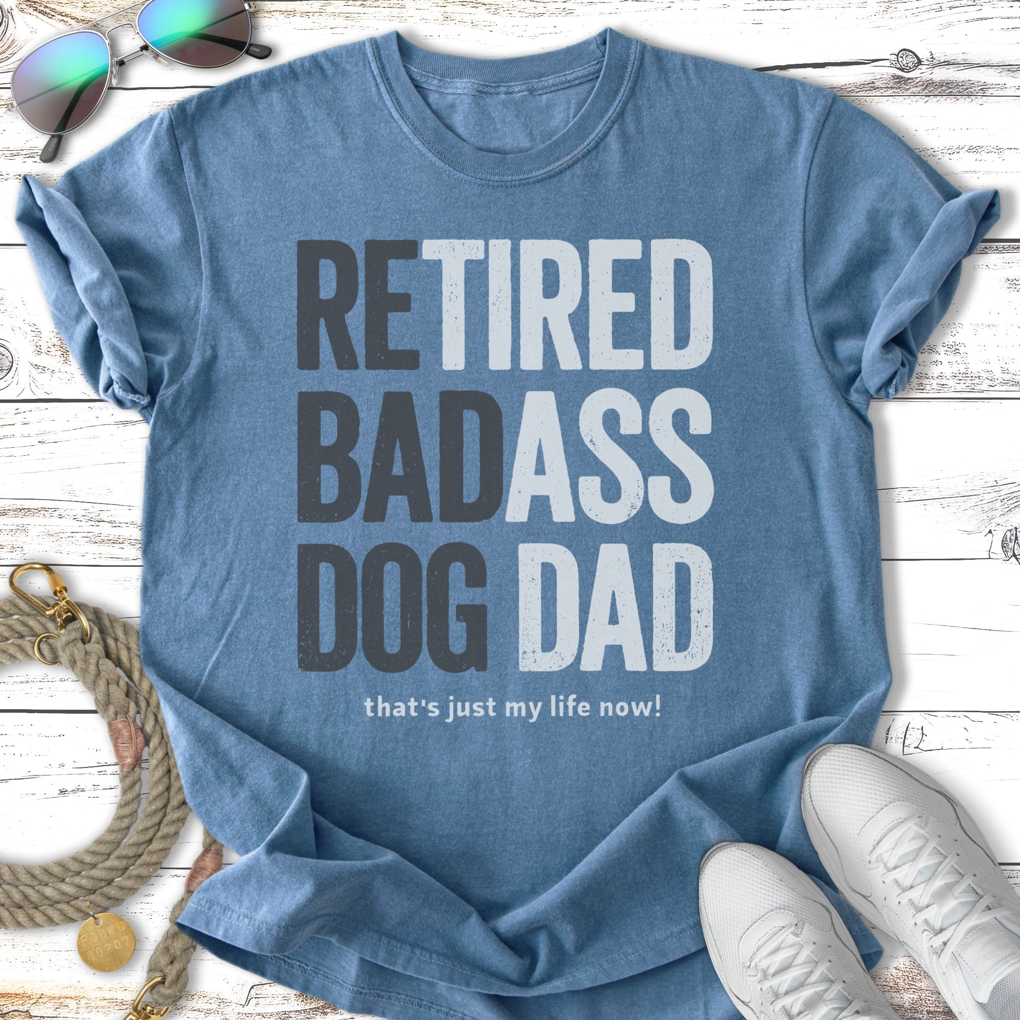 Blue t-shirt with "Retired Badass Dog Dad" text.