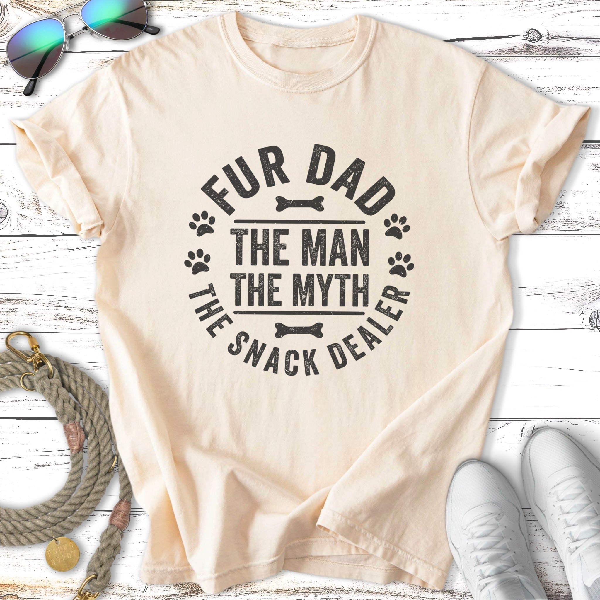 Cream t-shirt with black text "Fur Dad The Man The Myth The Snack Dealer".