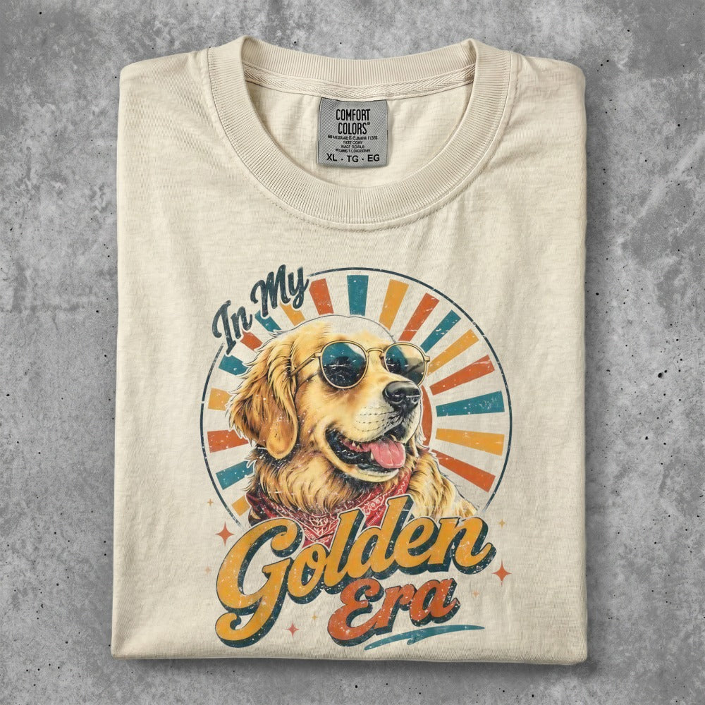 Cream t-shirt featuring a golden retriever wearing sunglasses with "Golden Era" text.