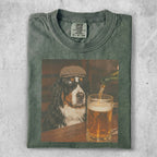 Bernese Mountain Dog wearing sunglasses and cap, looking at beer.