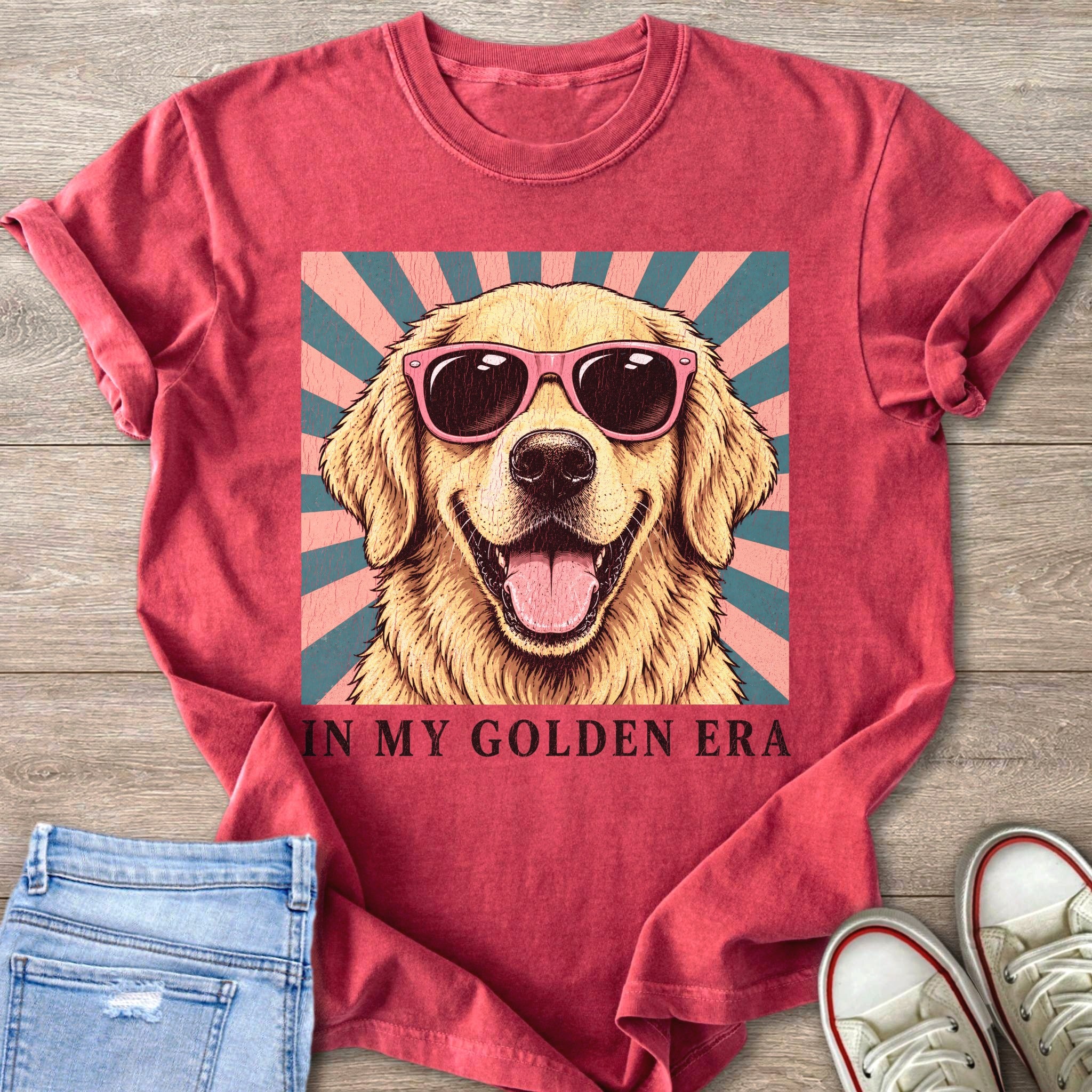 Crimson t-shirt with a golden retriever wearing pink sunglasses and text "IN MY GOLDEN ERA".