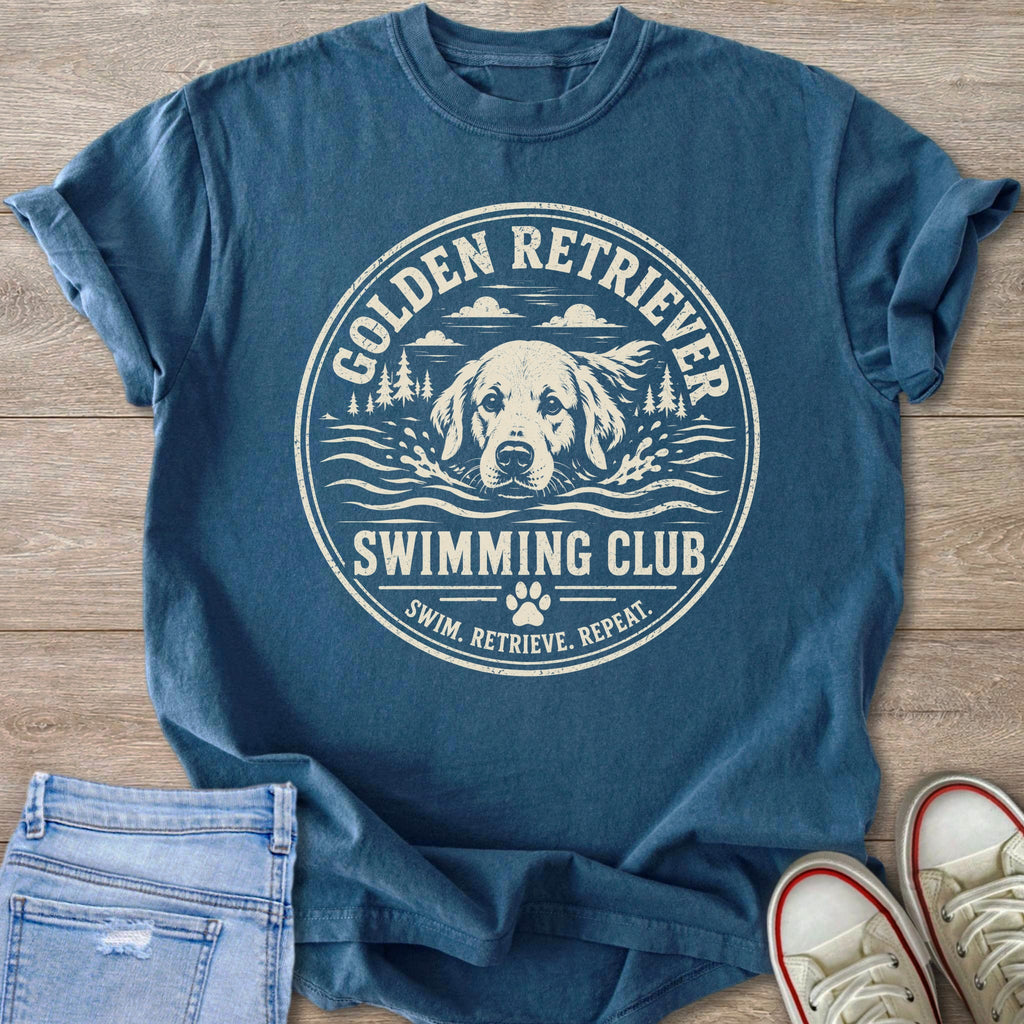 Blue t-shirt with print of Golden Retriever swimming, text "SWIMMING CLUB".
