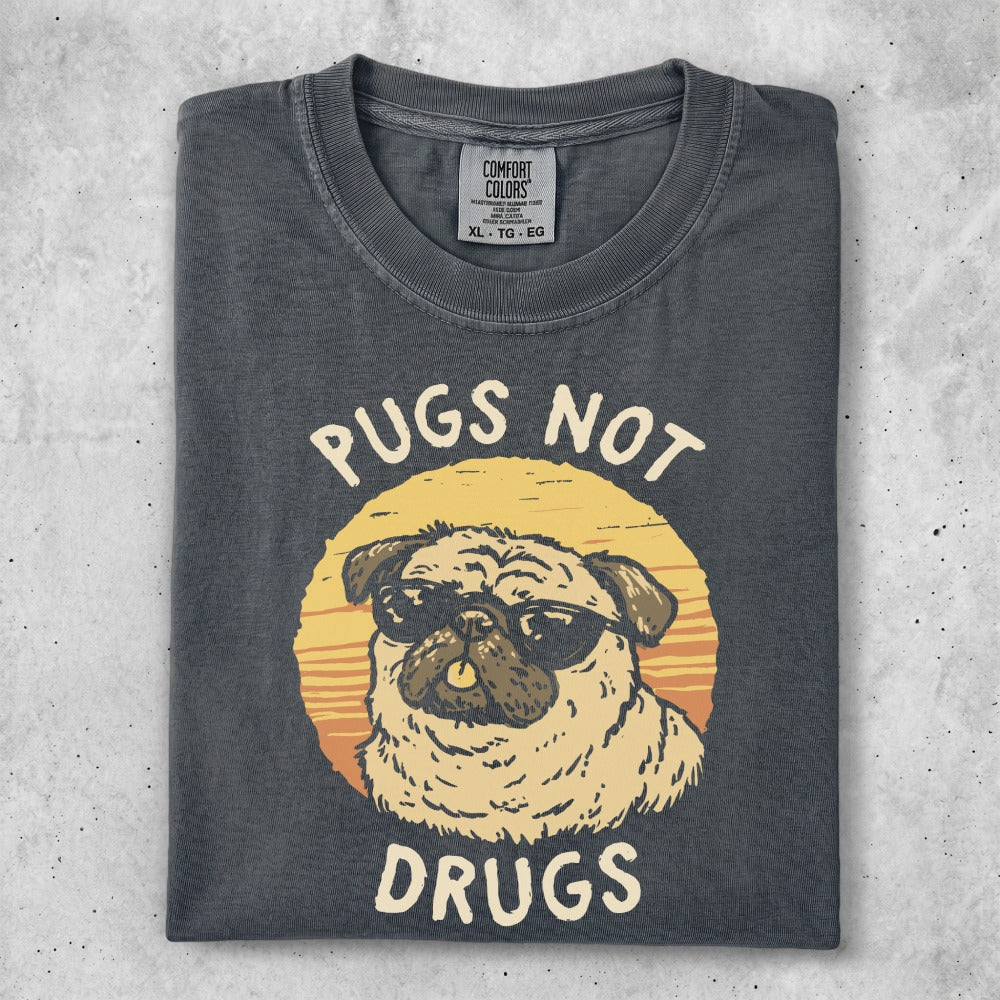 Dark gray t-shirt with a sun graphic and a pug wearing sunglasses, text reads "Pugs Not Drugs".