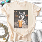 Husky dog wearing sunglasses holds an iced coffee drink.