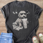 Gray t-shirt with distressed print of a fluffy dog wearing sunglasses drinking an iced coffee.