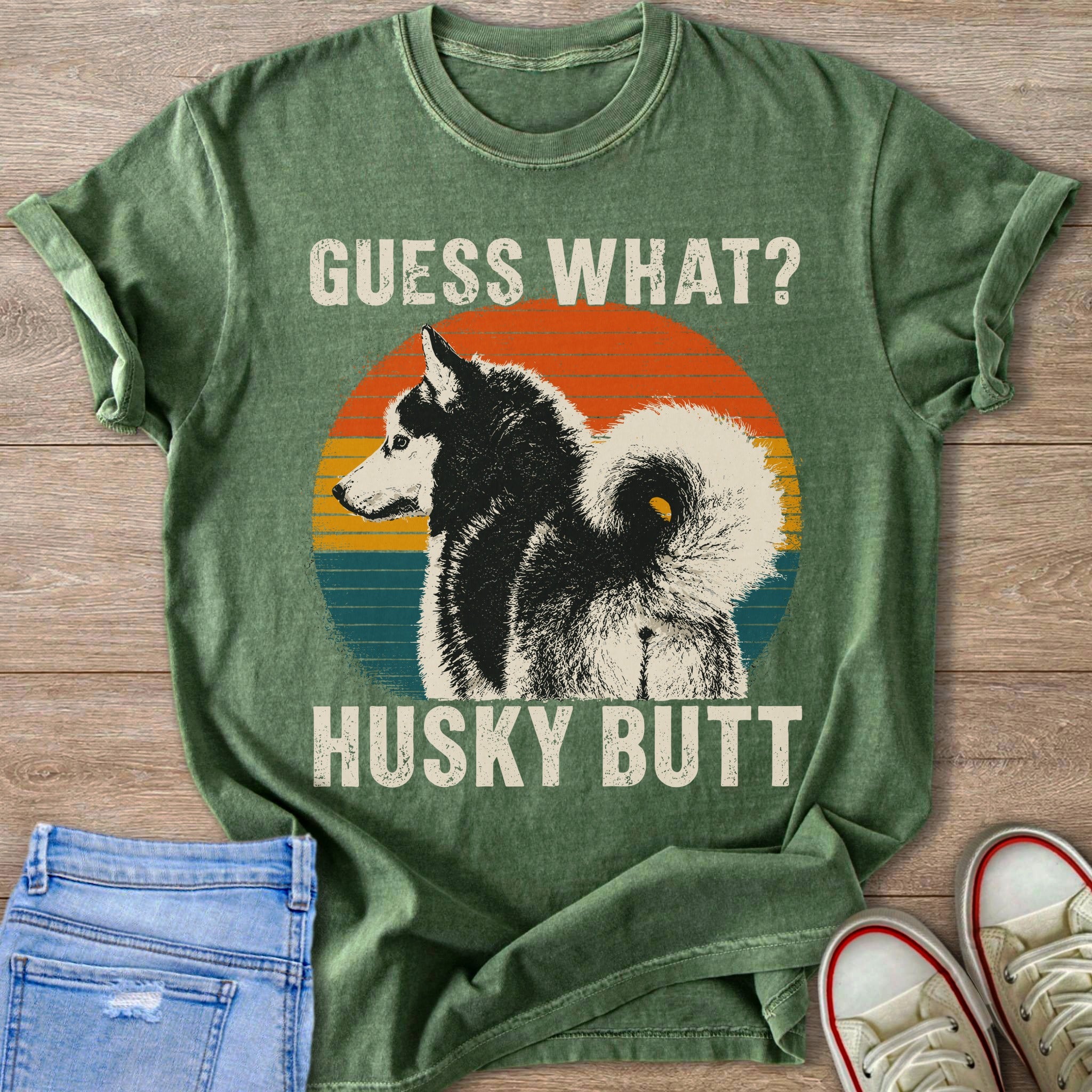 Green t-shirt with text "GUESS WHAT?" and husky dog with "HUSKY BUTT".
