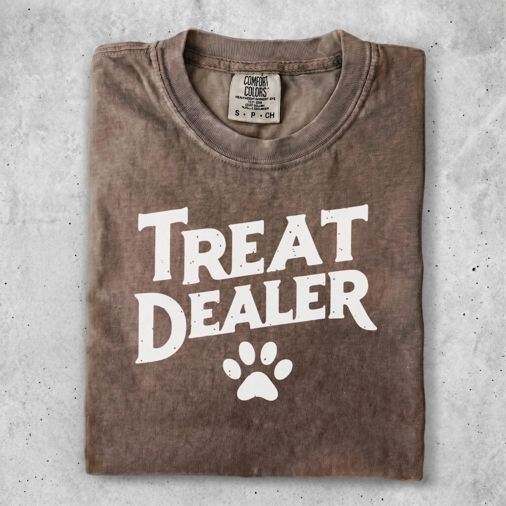 T-shirt with "Treat Dealer" and a paw print graphic.