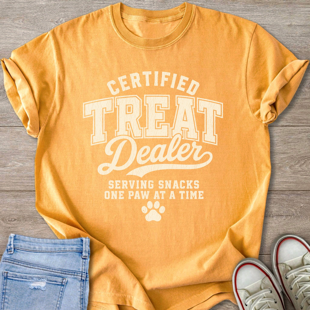 Orange t-shirt with "Certified Treat Dealer" and "Serving Snacks One Paw At A Time" text.