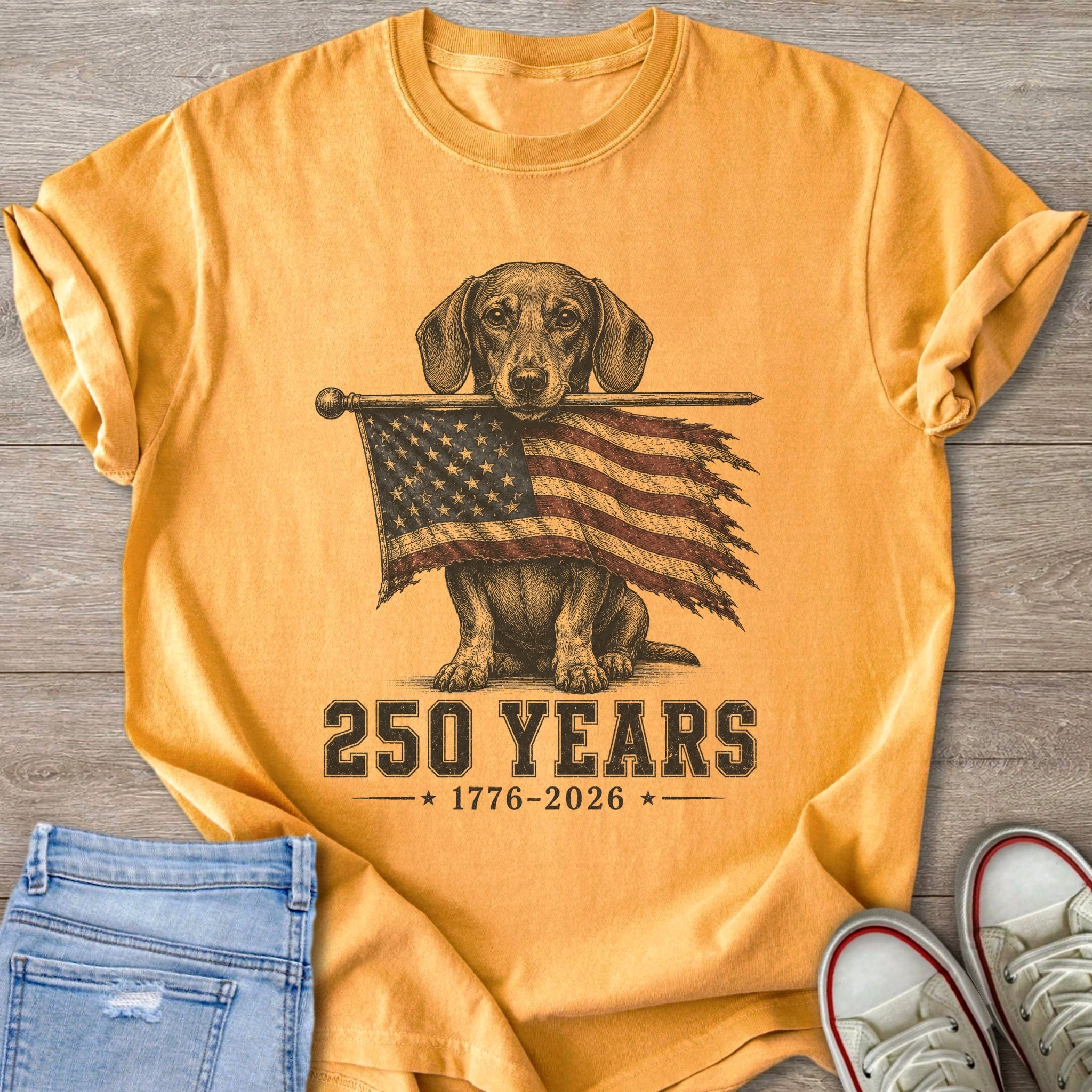 Dachshund holding American flag with 250 Years 1776-2026 text.